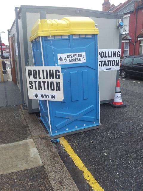 Ruth-Barnett-haringey.jpg - Not sure what's worse: the sign on the left spelling "polling" incorrectly, or the one on the right suggesting the Portaloo is the polling booth.