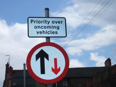 normal_027.JPG - "Boss, we've run out of 'priority over oncoming vehicles' signs.""Don't worry, just put one of those 'oncoming vehicles have priority' signs on the pole the wrong way up - nobody will notice."