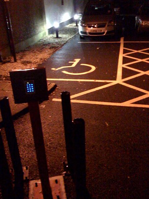 photo.jpg - Where is the most awkward place we can think of to put our disabled space?  Ah, here it is.